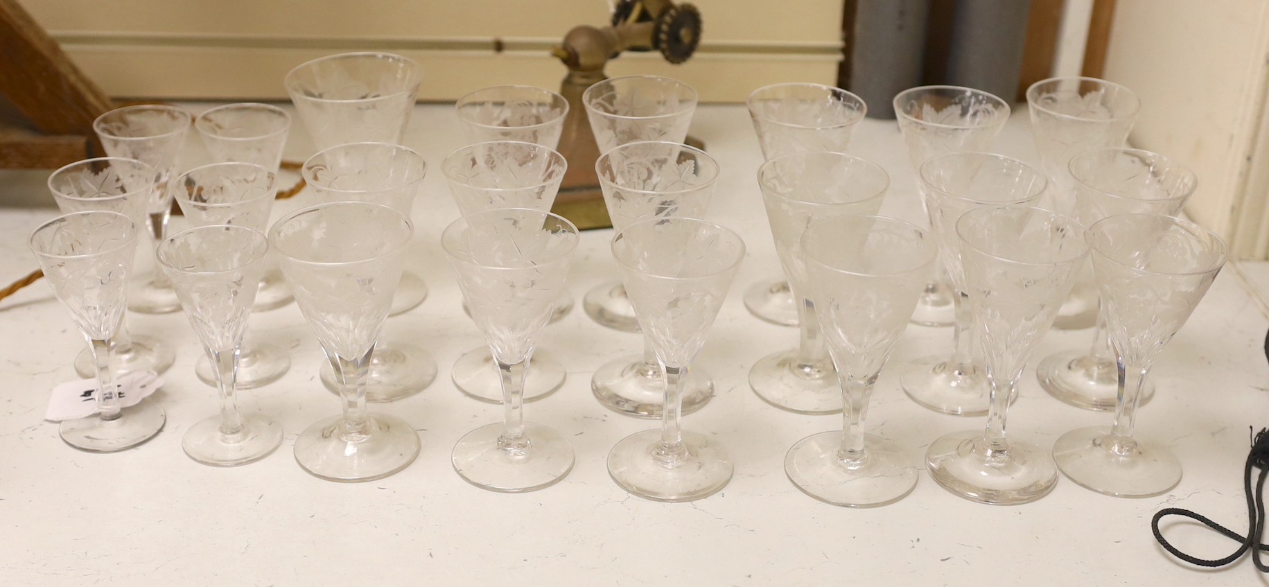 A collection of vine engraved aperitif glasses